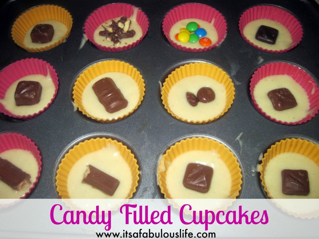 Candy Filled Cupcakes - Awesome idea for all of your leftover Halloween candy!!  Super easy too!