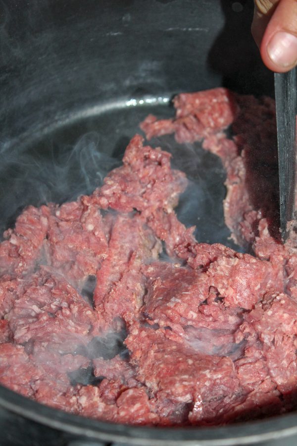 2. Add ground beef and cook, crumbling the beef as it cooks.